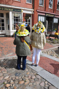 two ladies wearing daffodil's decorated hats cape cod island