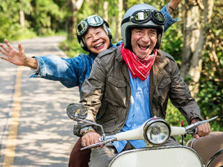two people having fun riding mopeds_cape cod retirement communities