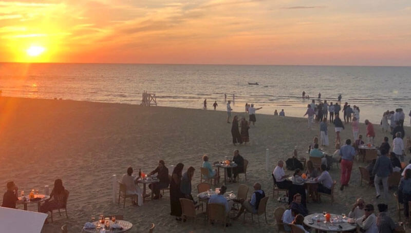 white sand people dinning outside beach enjoying sunset cape cod island