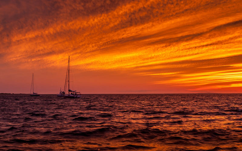 sunset boat sailing cape cod island
