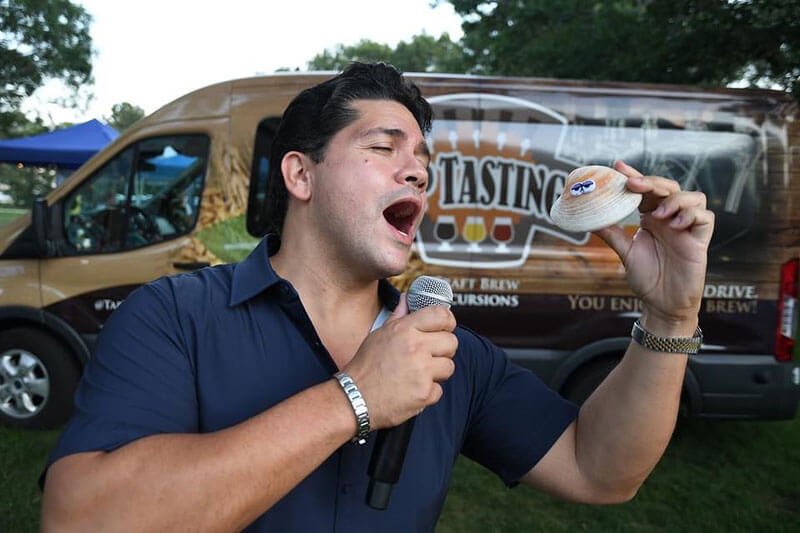 person acting singing brew bus background cape cod