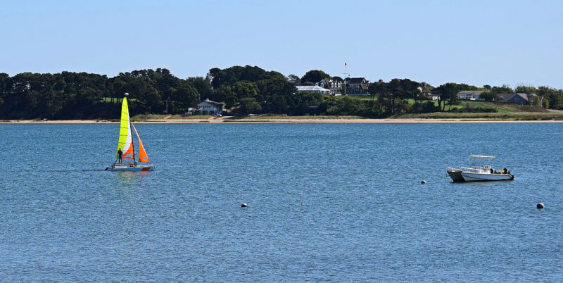 two boats sailing blue water cape cod island