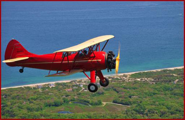 red plane flying aerial tour cape cod island